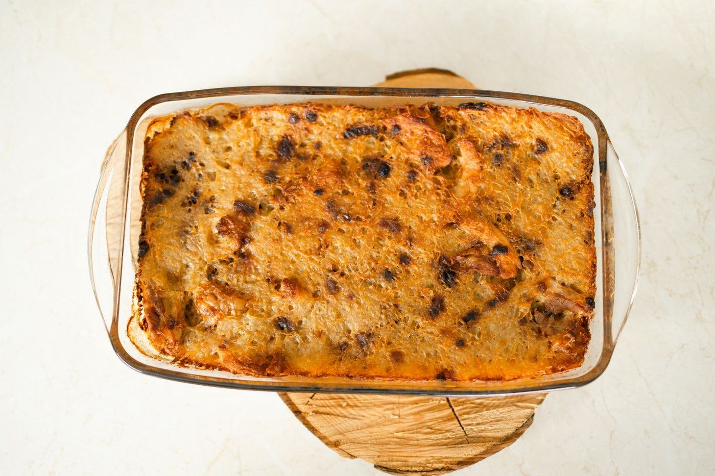 A freshly baked golden casserole in a glass dish